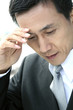 Businessman with hand on head