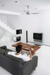 Man watching television in the living room