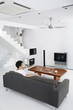 Man watching television in the living room