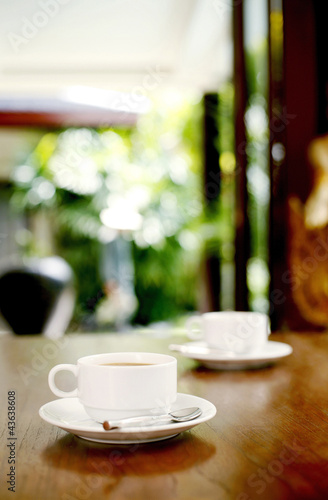 Photo: Two cups of coffee on the table Two cups of coffee on the table
