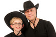 man and child with cowboy hats