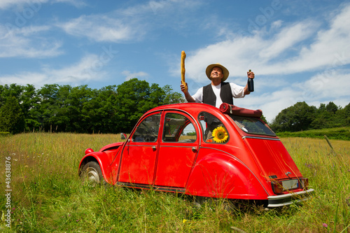 Foto: French man with his typical red car French man with his typical red car