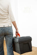 Woman carrying a toolbox