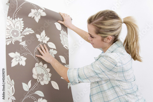Photo: Woman holding wallpaper Woman holding wallpaper