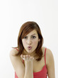 Woman giving a flying kiss