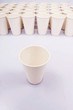A group of paper cups with an isolated paper cup