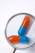 Capsules as seen through magnifying glass
