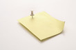 A note fastened with a map pin