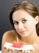 Woman holding a lighted aromatherapy candle
