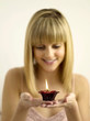 Pretty girl holding a lighted aromatherapy candle