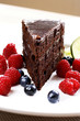 Chocolate cake and berries on a plate
