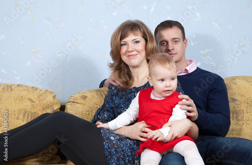 Photo: Happy parents with baby Happy parents with baby