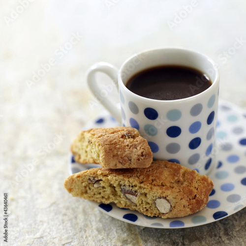 Photo: Italian espresso in spotty blue cup with cantuccini biscuits Italian espresso in spotty blue cup with cantuccini biscuits