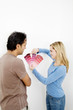 Couple choosing suitable colour from the colour chart