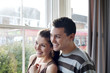 Couple enjoying the view from the window