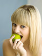 Woman biting an apple