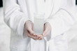 Hands holding a glass of effervescence
