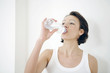 Woman drinking bottled water