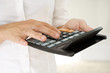 Businesswoman with calculator