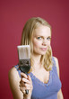 Woman holding a paint brush
