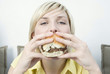 Woman eating a hamburger
