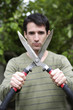 Man holding hedge clippers