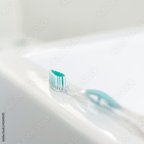 Photo: Toothbrush on the sink Toothbrush on the sink