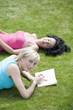 Two women in the park reading books
