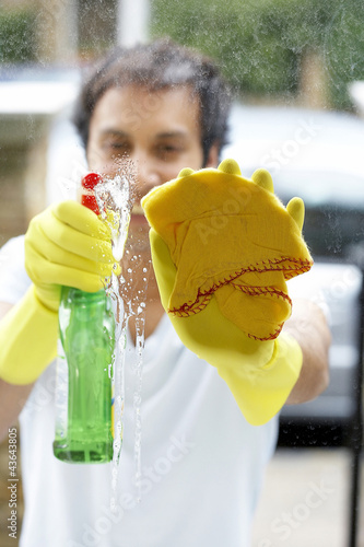 Photo: Man cleaning the window Man cleaning the window