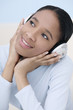 Photo: Woman listening to music on the headphones Woman listening to music on the headphones