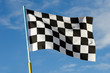 Checkered flag with blue sky