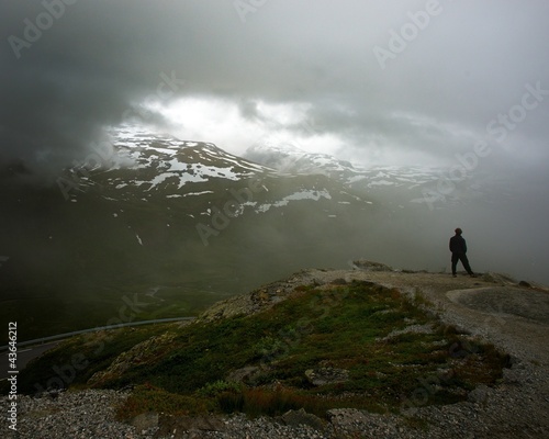 Photo: Somebody standing on hill's edge Somebody standing on hill's edge