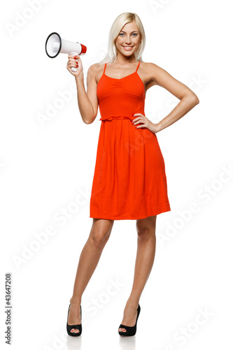 Photo: Full length of female in red dress holding loudspeaker Full length of female in red dress holding loudspeaker