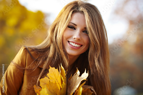 Photo: young brunette woman portrait in autumn color young brunette woman portrait in autumn color