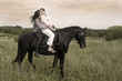 Photo: couple and horse in a field couple and horse in a field