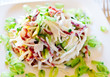 Salad with cabbage , sausage, cucumber and green peas