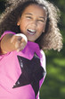 Foto: Mixed Race African American Girl Smiling & Pointing Mixed Race African American Girl Smiling & Pointing