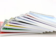 Pile Of Spiral Notebooks End View On White