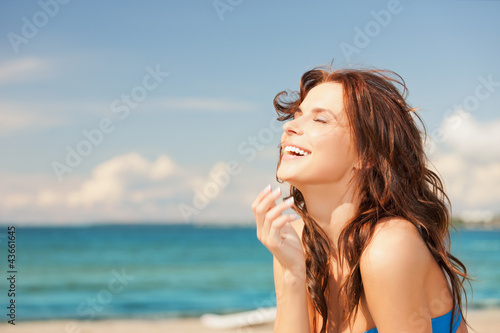 Photo: laughing woman on the beach laughing woman on the beach