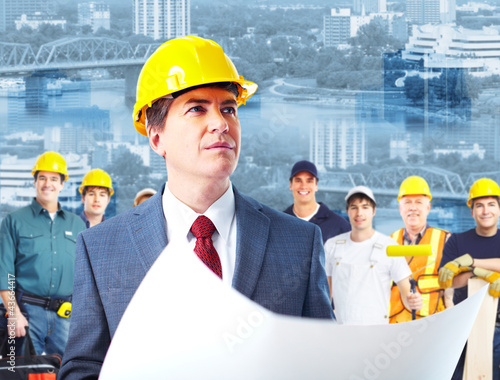 Photo: Architect and group of industrial workers. Architect and group of industrial workers.