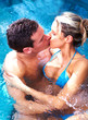 Young couple in jacuzzi.