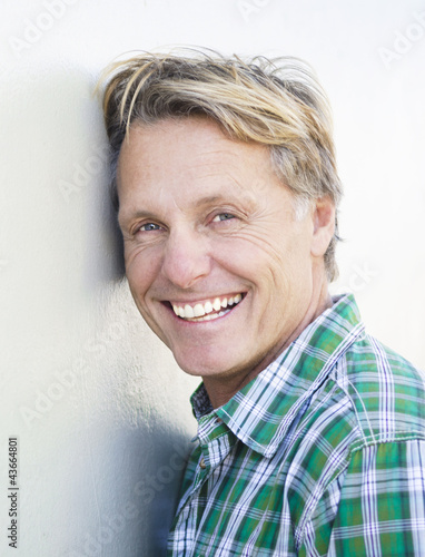 Photo: happy smiling mature man in forties. happy smiling mature man in forties.
