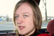 Blue-Eyed Teen In Car