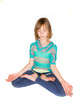 Foto: Young girl meditating in a yoga class Young girl meditating in a yoga class