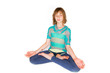 Foto: Young girl meditating in a yoga class Young girl meditating in a yoga class