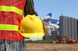 man holding yellow helmet