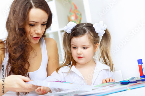 Photo: Mother and daughter studying Mother and daughter studying