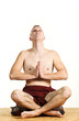 young man in meditation, portrait in studio