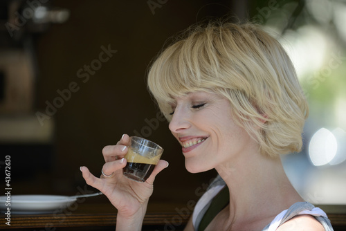 Photo: Woman having a coffee break Woman having a coffee break