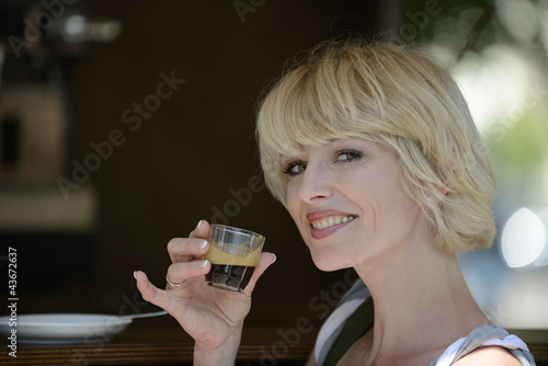 Photo: Woman having a coffee break Woman having a coffee break